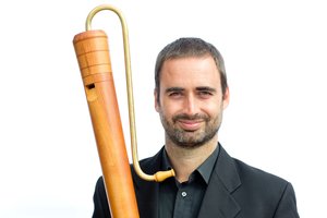 Photo of Merlin holding a bass recorder