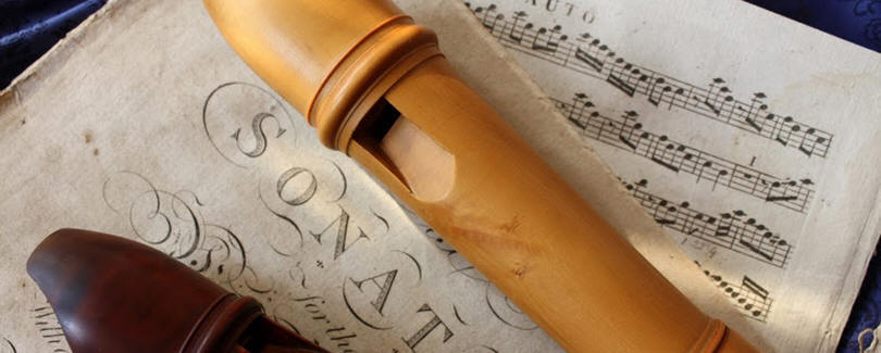 footer image: a recorder and some sheet music
